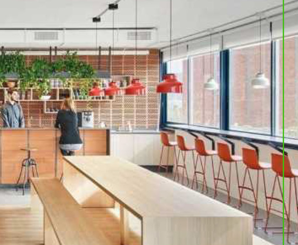 interior with bar, desk, and red chairs